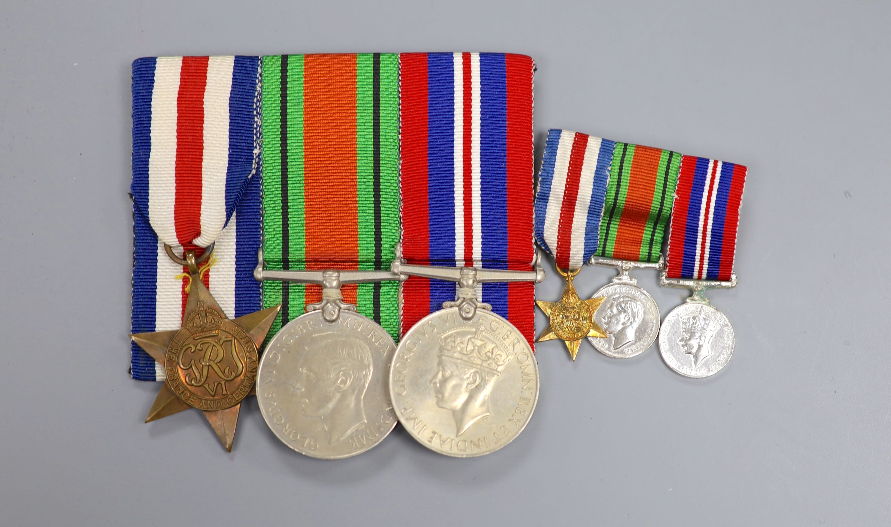 A WW2 trio of medals and matching miniatures, unnamed